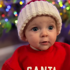 Baby wearing santa hat front view
